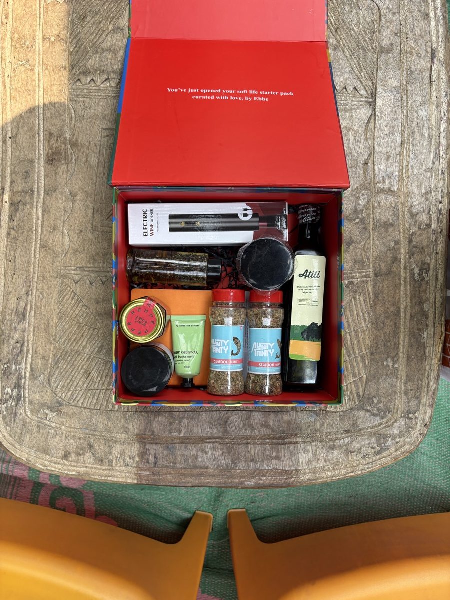 An EBBE box packed with bottles and jars on a wooden table